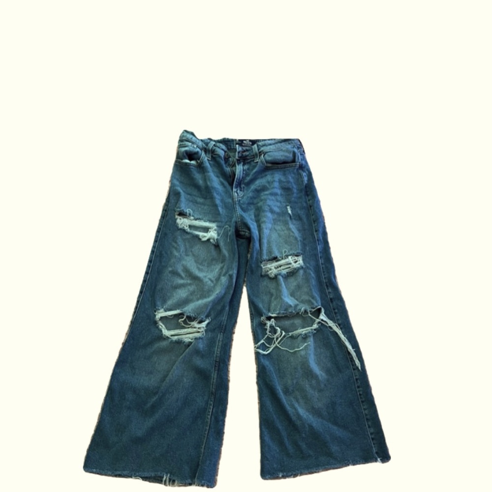 Ripped wide leg blue jeans.